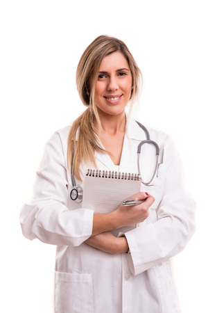 Beuatiful young medic posing isolated over a white backgroundの写真素材