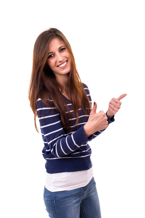 Beautiful young woman signaling ok, isolated over whiteの写真素材