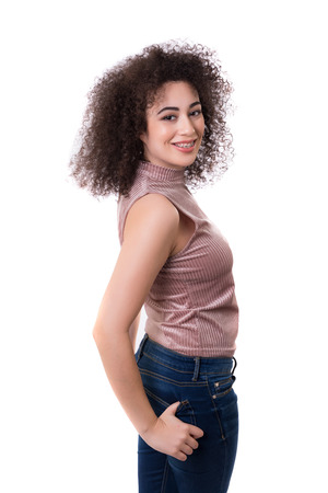 Happy young woman - who weares braces - posing isolated over whiteの写真素材