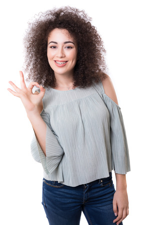 Beautiful young business woman presenting your productの写真素材