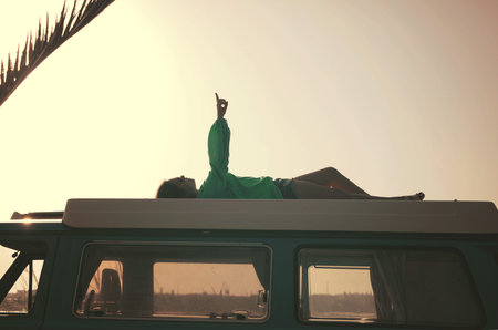 summer holidays, road trip, travel and people concept, young woman resting in minivan car