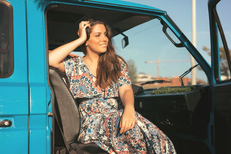 summer holidays, road trip, travel and people concept, young woman resting in minivan carの写真素材