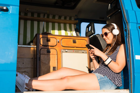 summer holidays, road trip, travel and people concept, young woman resting in minivan car