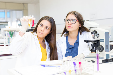 Beautiful young scientists working at the laboratoryの写真素材