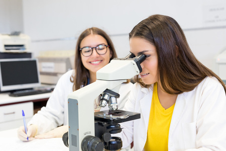 Beautiful young scientists working at the laboratoryの写真素材