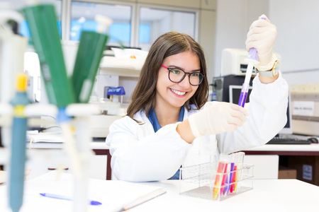 Beautiful young scientist working at the laboratoryの写真素材