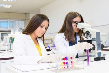 Beautiful young scientists working at the laboratoryの写真素材