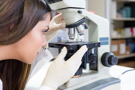 Beautiful young scientist working at the laboratory