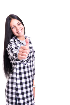 Beautiful young woman signaling ok, isolated over whiteの写真素材
