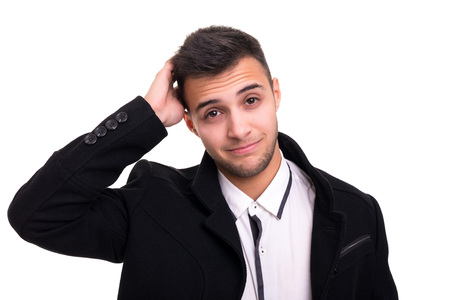 Studio picture of a young and handsome man posing isolatedの写真素材