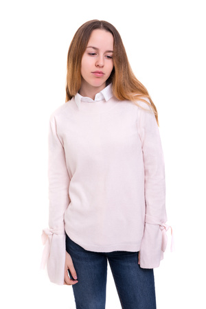 Studio shot of a sad woman, isolated over whiteの写真素材