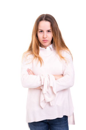 Studio shot of a sad woman, isolated over whiteの写真素材