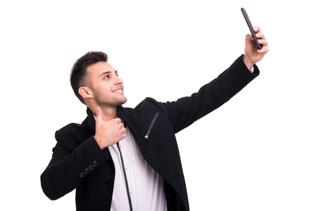 Young man at the phone, isolated over white backgroundの写真素材