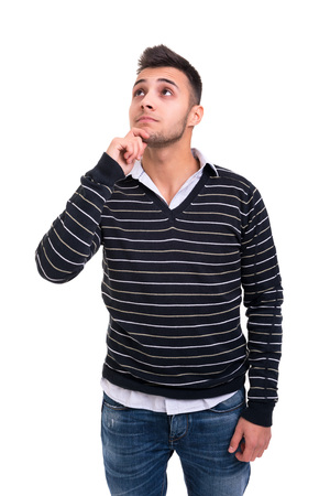 Studio picture of a pensive young man, isolated over whiteの写真素材