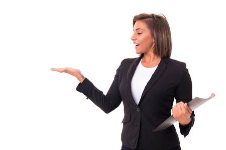 Young beautiful african woman presenting your product, isolated over white backgroundの写真素材