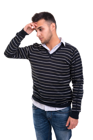 Troubled young man posing isolated over white backgroundの写真素材
