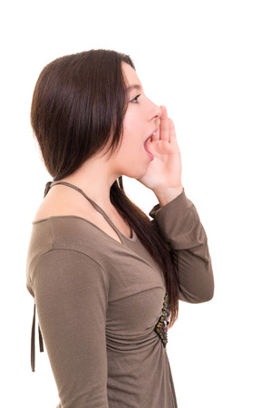 Woman screaming at someone, isolated over a white backgroundの写真素材