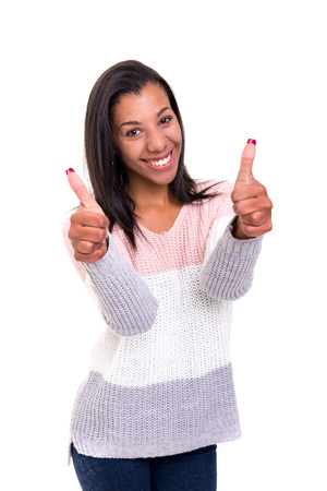 Beautiful african young woman signaling ok, isolated over whiteの写真素材