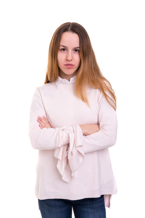 Studio shot of a sad woman, isolated over whiteの写真素材