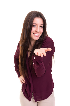 Beautiful young woman blowing you a kiss, isolated over whiteの写真素材