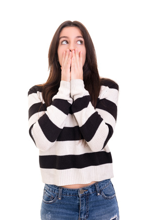 Surprised young woman isolated over white backgroundの写真素材
