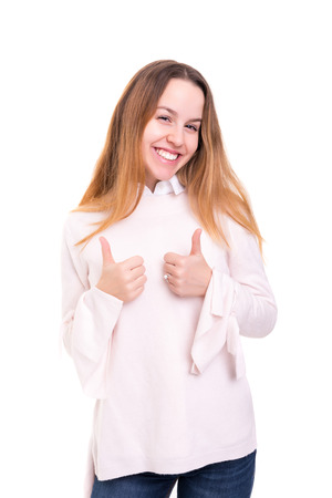 Beautiful young woman signaling ok, isolated over whiteの写真素材