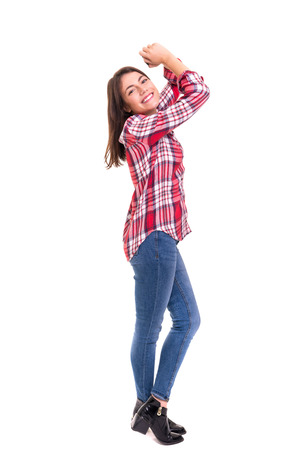 Studio shot: Happy woman with raised armsの写真素材