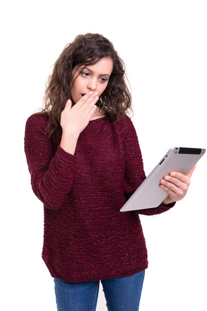 beautiful woman working with a new tablet computer, isolated over white backgroundの写真素材