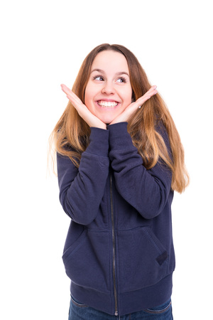 Surprised young woman isolated over white backgroundの写真素材