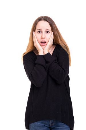 Surprised young woman isolated over white backgroundの写真素材
