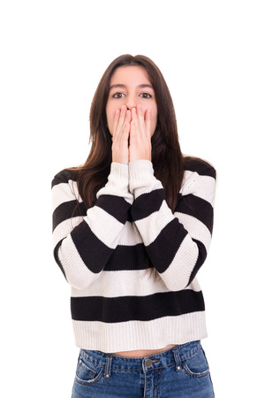 Surprised young woman isolated over white backgroundの写真素材