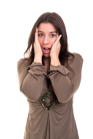 Surprised young woman isolated over white backgroundの写真素材