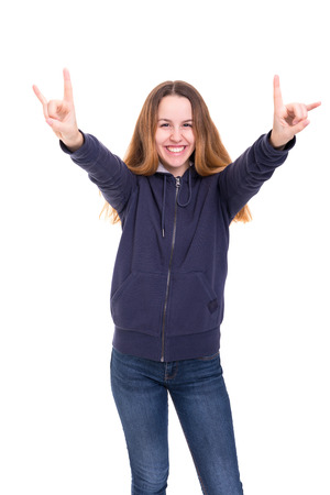 Studio shot: Happy woman with raised armsの写真素材