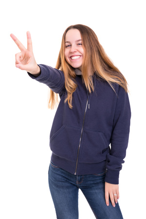 Beautiful young woman signaling ok, isolated over whiteの写真素材