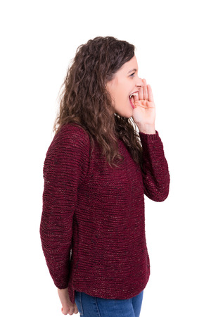 Woman screaming at someone, isolated over a white backgroundの写真素材
