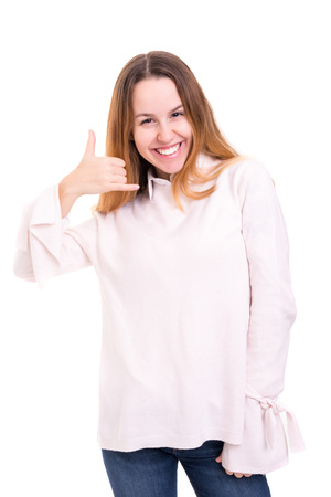 Happy young student making "call me" sign with handの写真素材