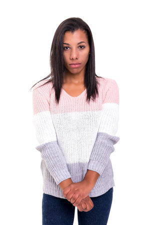 Studio shot of a sad african woman, isolated over whiteの写真素材