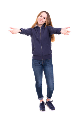 Studio shot of a beautiful woman offering a hugの写真素材