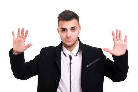 Young business man ordering you to stopの写真素材
