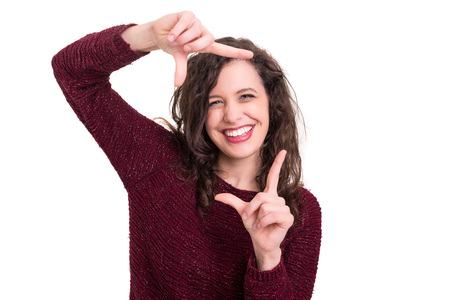 Young woman making framing key gesture - isolated over whiteの写真素材