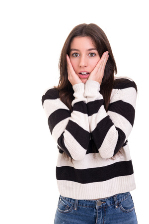 Surprised young woman isolated over white backgroundの写真素材