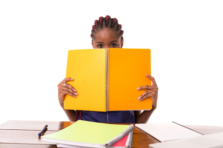 Beautiful african student woman posing isolated over white backgroundの写真素材