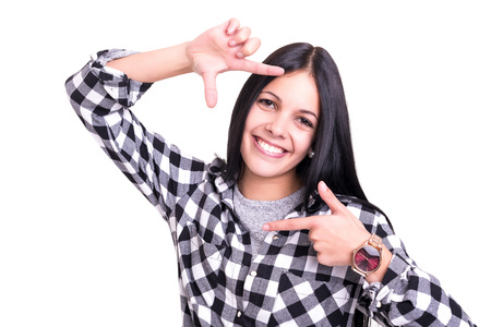 Young woman making framing key gesture - isolated over whiteの写真素材