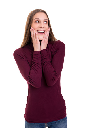 Surprised young woman isolated over white backgroundの写真素材