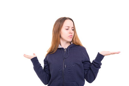 Young beautiful woman presenting your product, isolated over white backgroundの写真素材