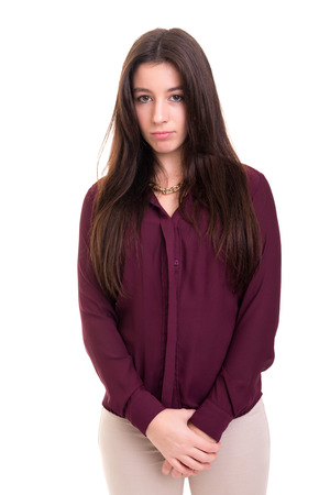 Studio shot of a sad woman, isolated over whiteの写真素材
