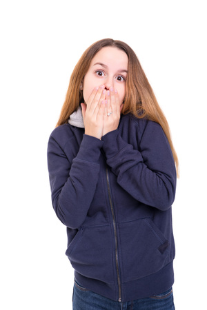 Surprised young woman isolated over white backgroundの写真素材