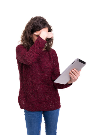 beautiful woman working with a new tablet computer, isolated over white backgroundの写真素材