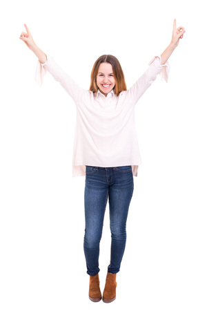 Studio shot: Happy woman with raised armsの写真素材