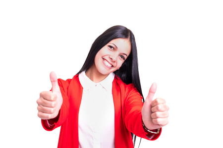 Beautiful young woman signaling ok, isolated over whiteの写真素材